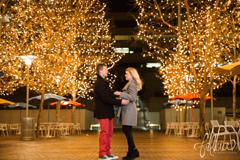 engagement photos | night engagement photos | Union Station | Kansas City | images by feliciathephotographer.com | romantic engagement | dramatic background | romantic poses | Christmas engagement photos | white lights | Christmas lights | dancing in the park 