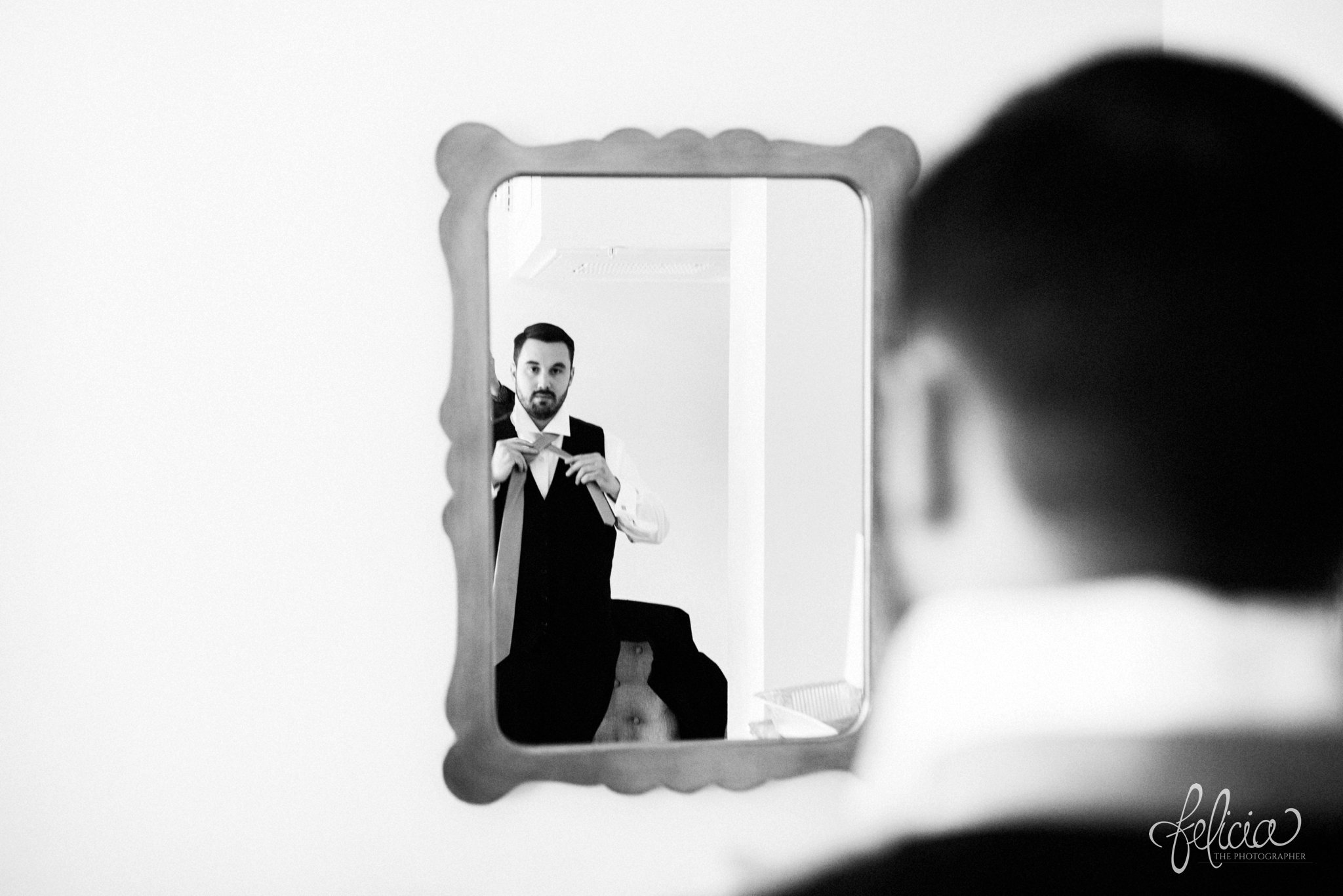 black and white |wedding | wedding photos | wedding photography | black and gold | Winter Wedding | Gatsby Wedding | The Elms | images by feliciathephotographer.com | Excelsior Springs | groom portrait | candid | mirror reflection | groom solo shot | before the wedding 