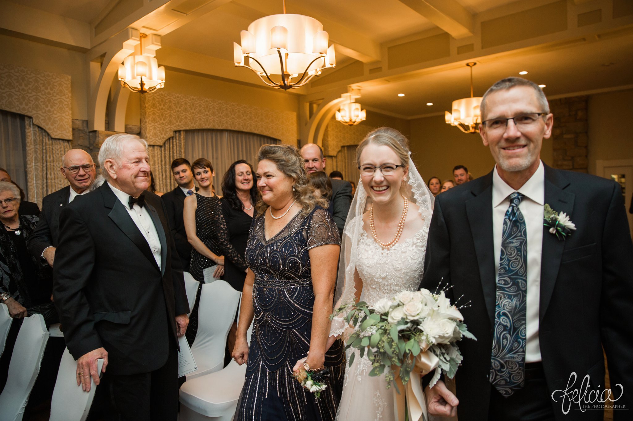 black and white | wedding | wedding photos | wedding photography | black and gold | Winter Wedding | Gatsby Wedding | The Elms | images by feliciathephotographer.com | Excelsior Springs | historic venue | gold ambiance | stone fireplace | wedding venue | wedding decor | gold accessories | bride down the aisle } smiling bride | candid 