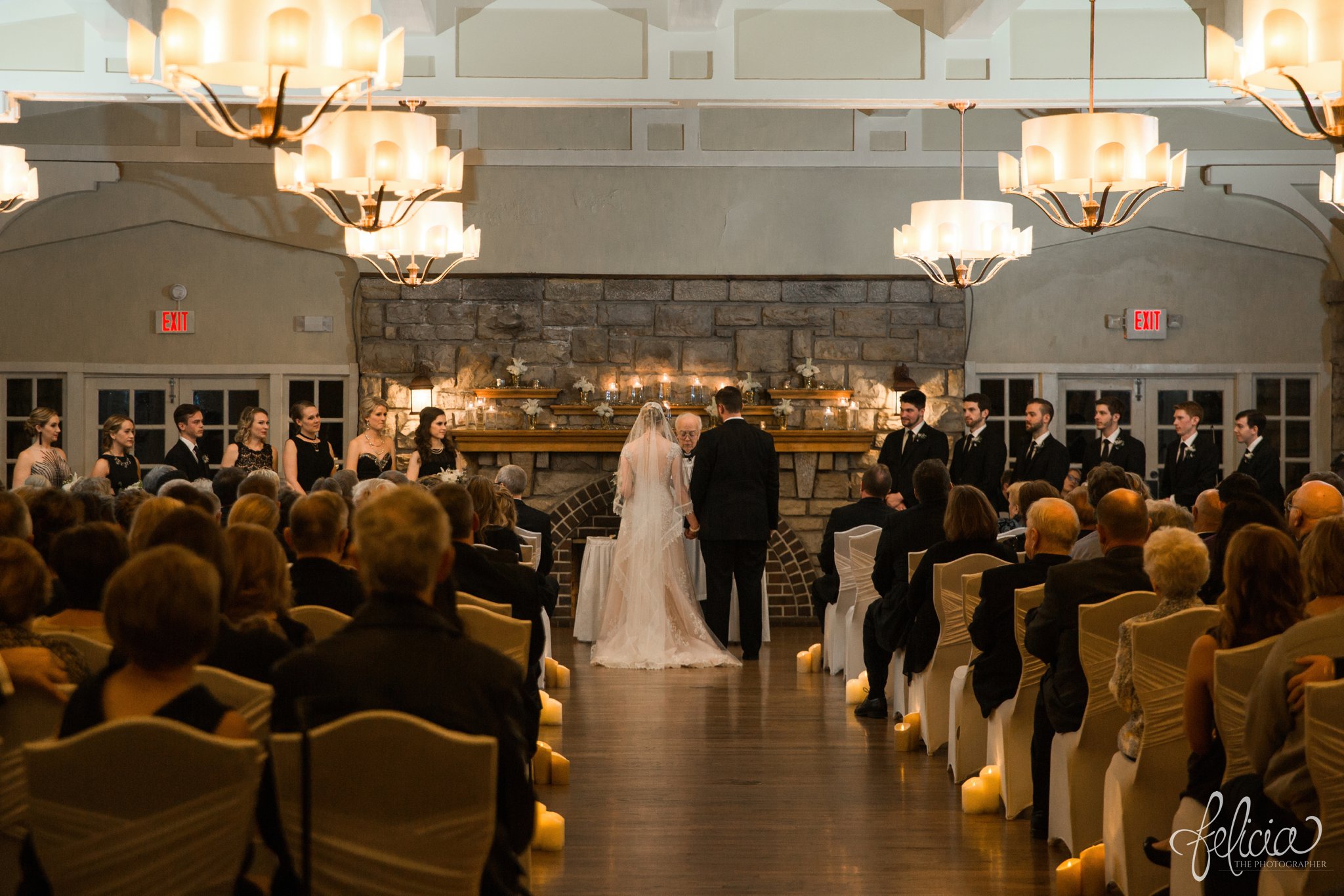 black and white | wedding | wedding photos | wedding photography | black and gold | Winter Wedding | Gatsby Wedding | The Elms | images by feliciathephotographer.com | Excelsior Springs | historic venue | gold ambiance | stone fireplace | wedding venue | wedding decor | gold accessories | wedding ceremony | bride and groom at altar | lace wedding dress | Maggie Sottero 