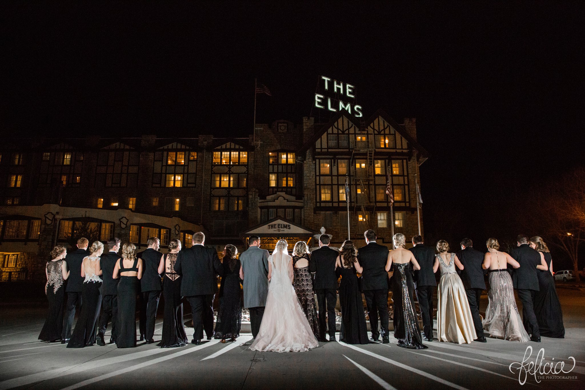 wedding | wedding photos | wedding photography | black and gold | Winter Wedding | Gatsby Wedding | The Elms | images by feliciathephotographer.com | Excelsior Springs | historic venue | family portrait | candid | laughing | back to camera 