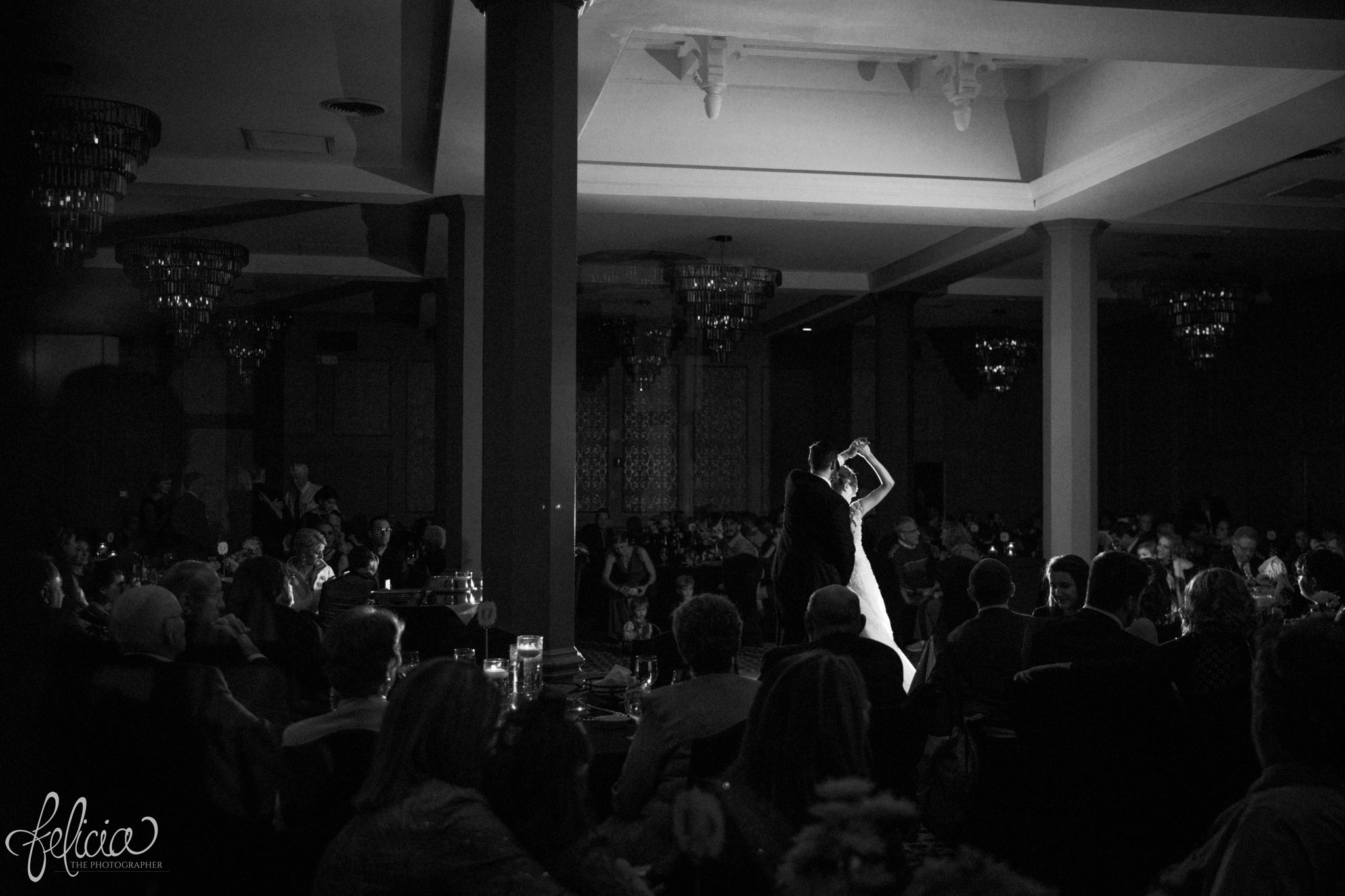 black and white | wedding | wedding photos | wedding photography | black and gold | Winter Wedding | Gatsby Wedding | The Elms | images by feliciathephotographer.com | Excelsior Springs | historic venue | first dance | romantic background | romance | chandeliers | Maggie Sottero | dramatic venue | romantic pose | dancing spin 