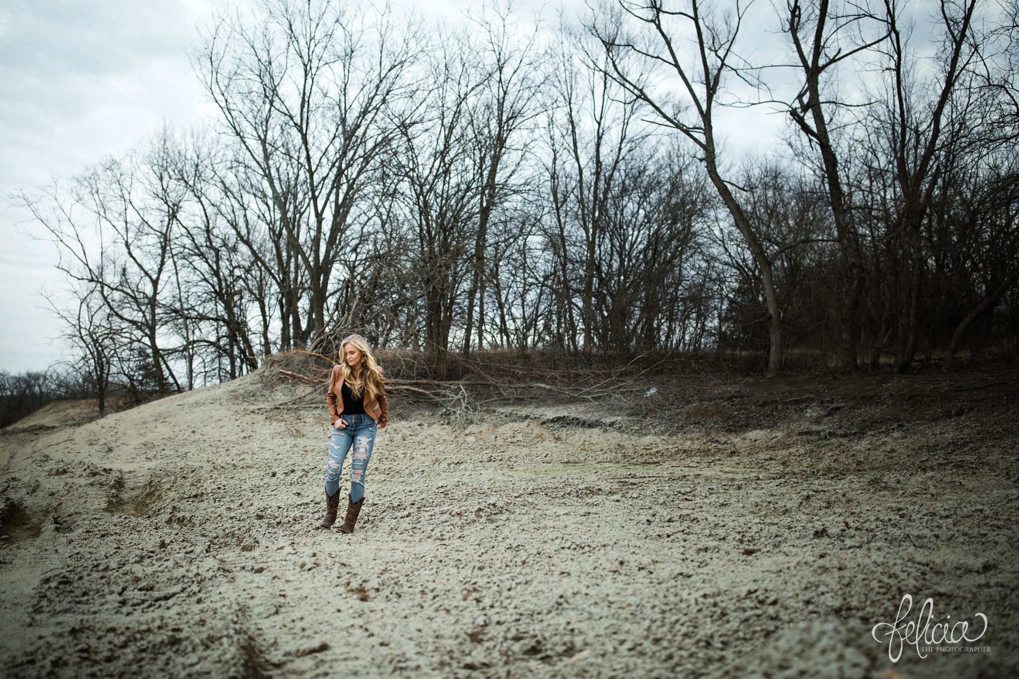 senior photos | senior photography | Lenexa | Kansas | images by feliciathephotographer.com | chic | dancer | dramatic pose | leather jacket  | candid | cowboy boots | rustic background | forest background 