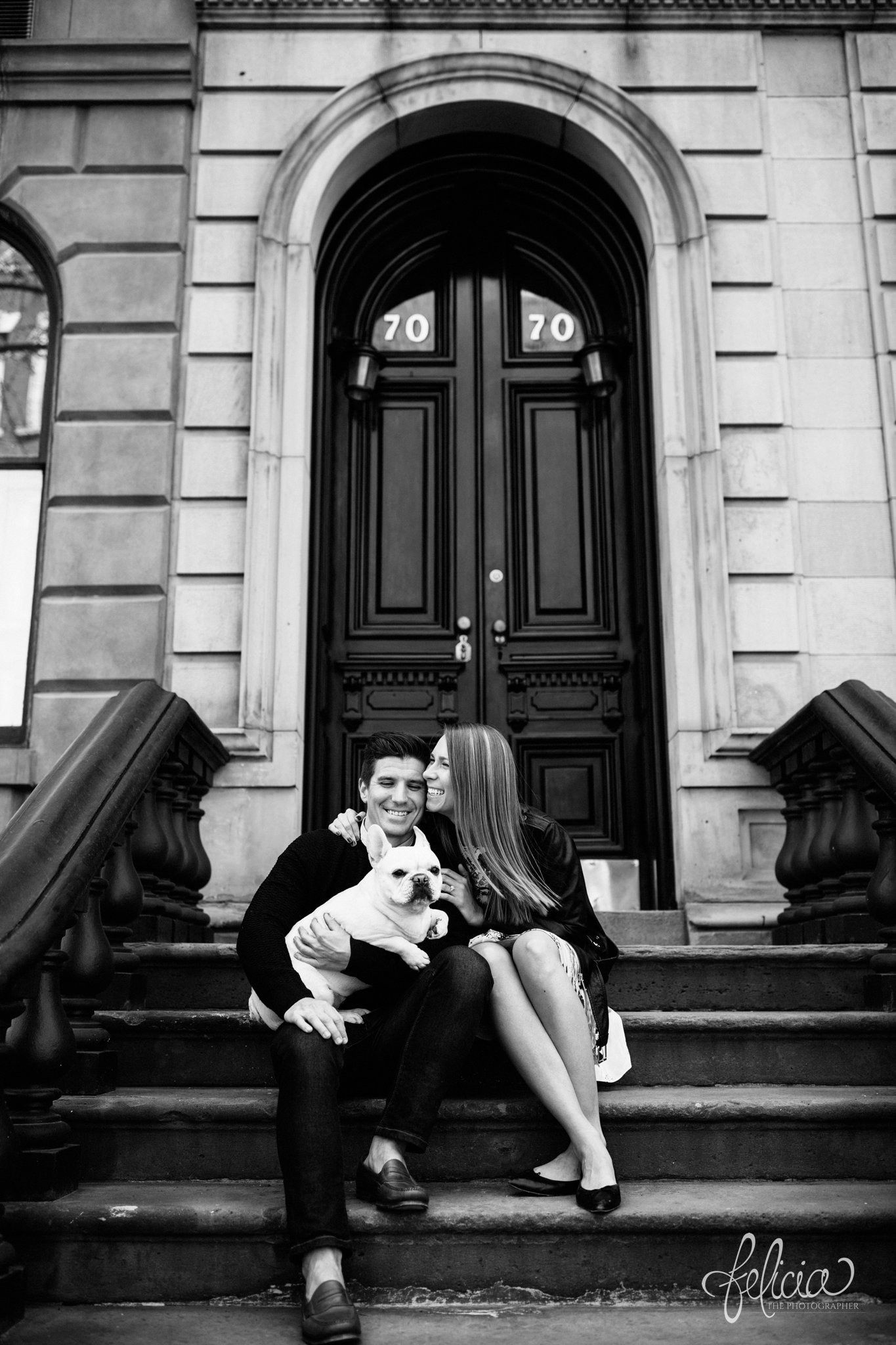 wedding | New York City | West Village | New York City photography | wedding photography | images by feliciathephotographer.com | engagement photos | engagement pictures in New York City | stairwell | French Bulldog | engagement photos with dog | romantic engagement photos | ring photography | candid | black and white | doorway | arched door frame 