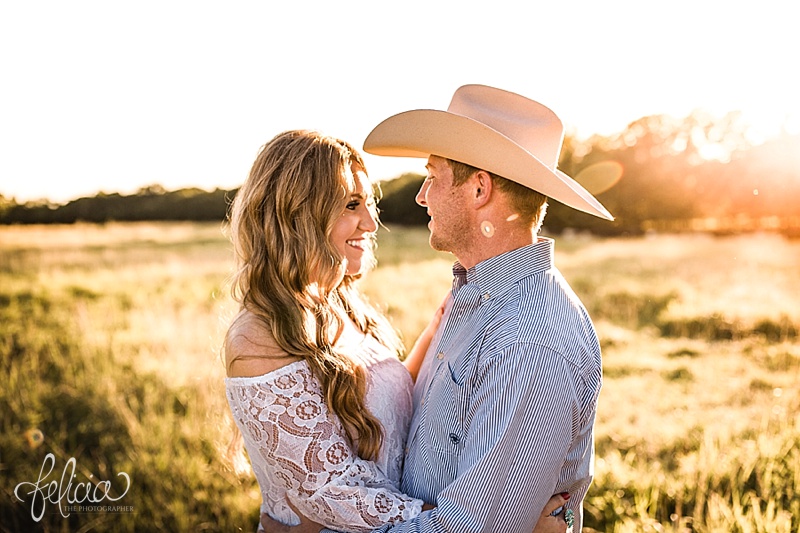 images by feliciathephotographer.com | engagement photographer | kansas farm | country | golden hour | sunset | romantic | true love | southern belle | bride to be | field | cowboy hat | holding hands 