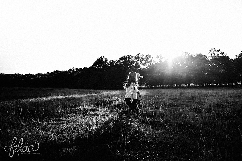 images by feliciathephotographer.com | engagement photographer | kansas farm | country | golden hour | sunset | romantic | true love | southern belle | bride to be | field | cowboy hat | holding hands | black and white 