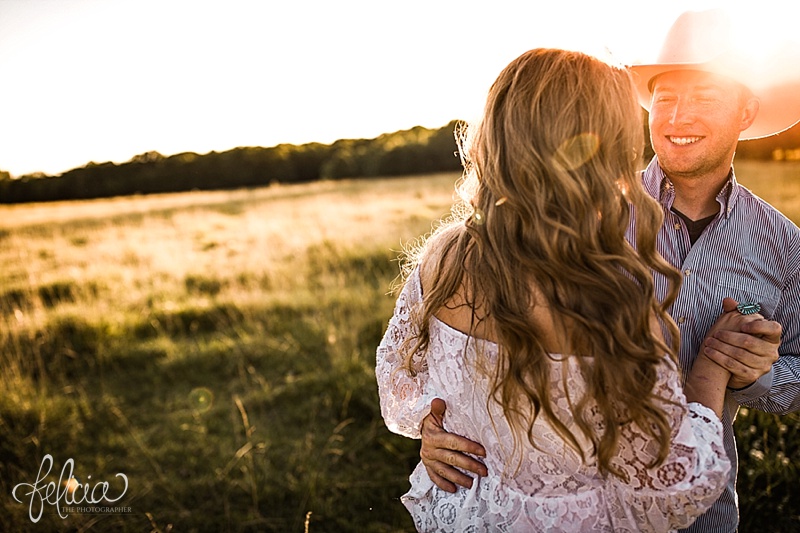 images by feliciathephotographer.com | engagement photographer | kansas farm | country | golden hour | sunset | romantic | true love | southern belle | bride to be | field | cowboy hat | dancing | playful