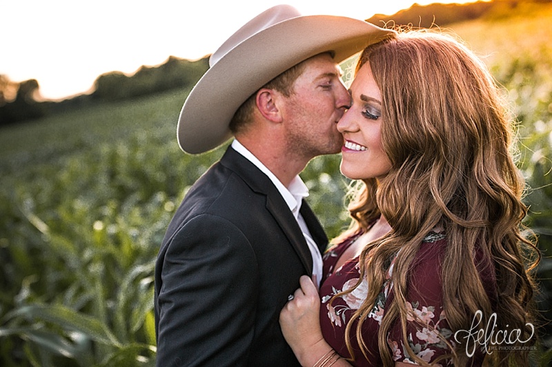 images by feliciathephotographer.com | floral dress | engagement photographer | kansas farm | country | golden hour | sunset | romantic | true love | southern belle | bride to be | corn field | cowboy hat | kiss