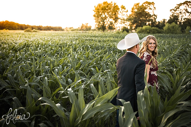 images by feliciathephotographer.com | engagement photographer | kansas farm | country | golden hour | sunset | romantic | true love | southern belle | bride to be | corn field | cowboy hat | floral dress