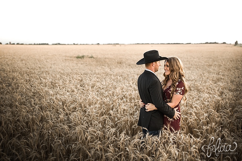 images by feliciathephotographer.com | engagement photographer | kansas farm | country | golden hour | sunset | romantic | true love | southern belle | bride to be | wheat field | cowboy hat | floral dress