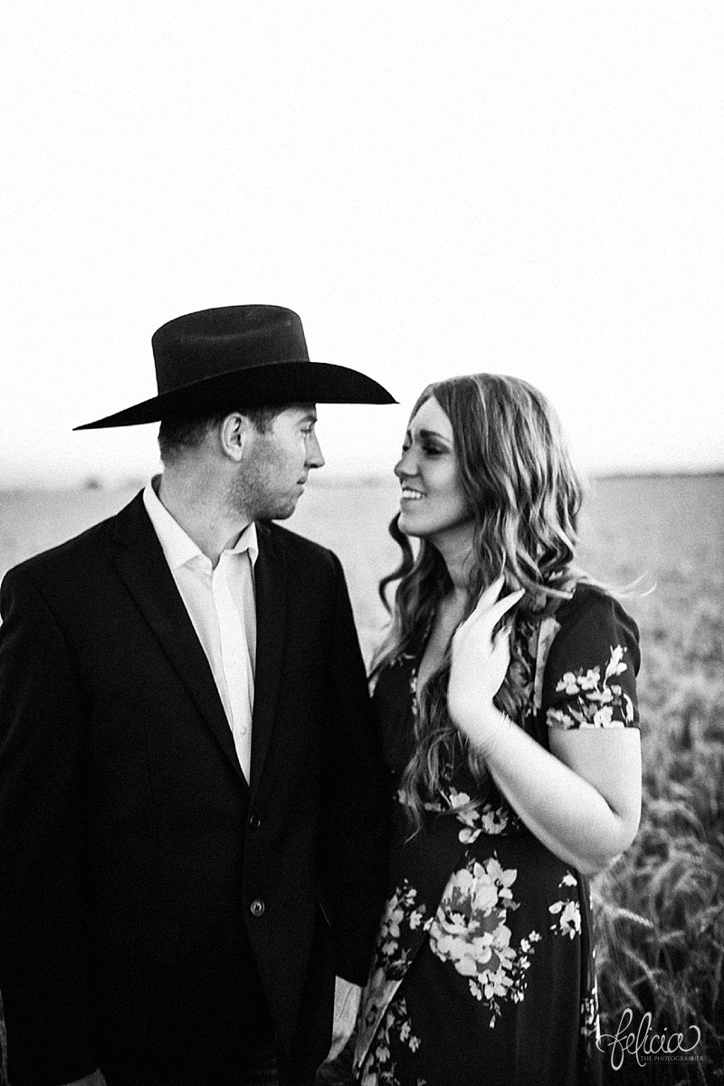  images by feliciathephotographer.com | engagement photographer | kansas farm | country | golden hour | sunset | romantic | true love | southern belle | bride to be | corn field | cowboy hat | floral dress | black and white