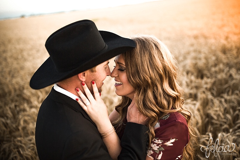images by feliciathephotographer.com | engagement photographer | kansas farm | country | golden hour | sunset | romantic | true love | southern belle | bride to be | wheat field | cowboy hat | floral dress | diamond ring 