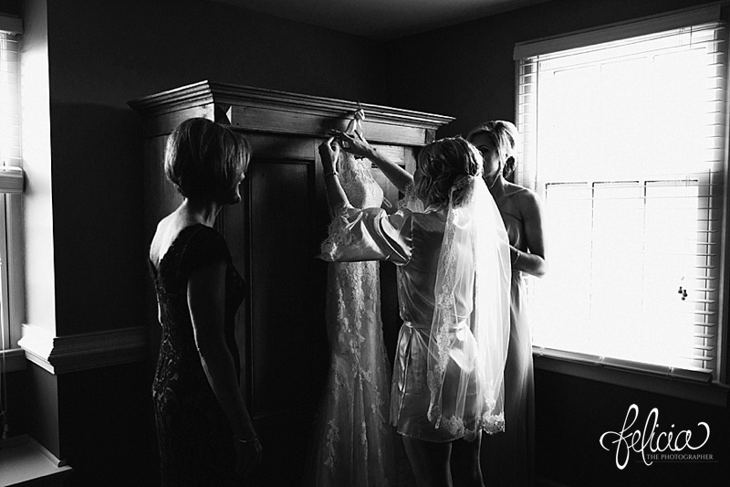images by feliciathephotographer.com | mildale farm | destination wedding photographer | kansas | country | black and white | getting ready | details | beading | putting on the dress | justin alexander | gown gallery 