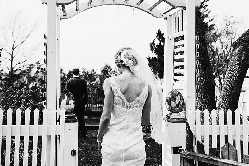 images by feliciathephotographer.com | mildale farm | destination wedding photographer | kansas | country | first look with groom | vintage estate | lace dress | justin alexander | gown gallery | peach flower bouquet | black and white | 