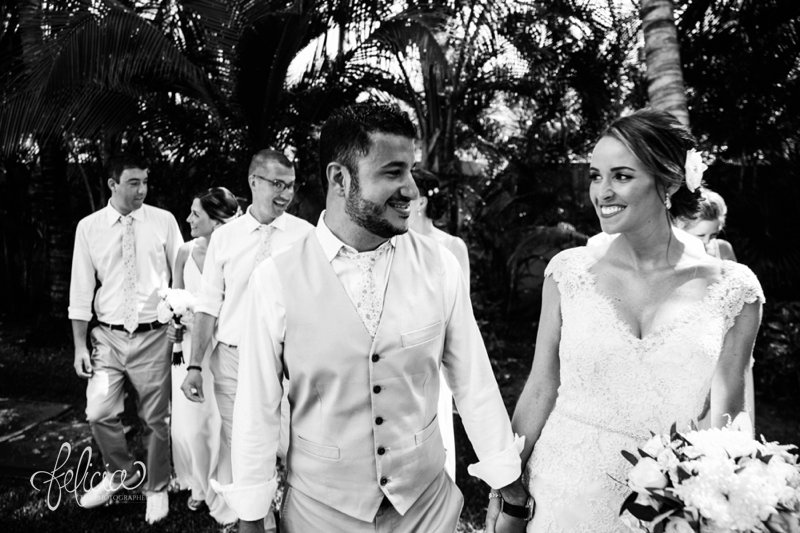 images by feliciathephotographer.com | Destination Beach Wedding | Mexico Resort | Photography | Azul Sensatori | holding hands | couple | married | pre-ceremony | bride and groom | black and white | vest | floral tie | bouquet | party | 