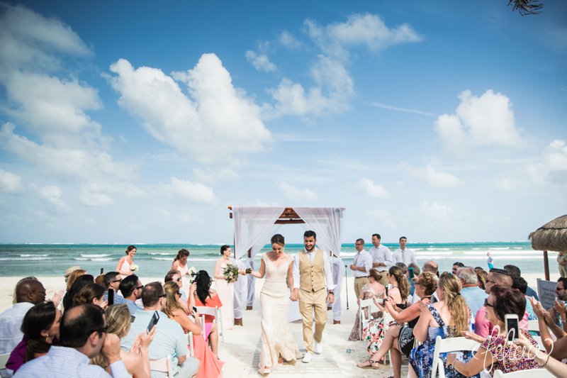 images by feliciathephotographer.com | Destination Beach Wedding | Mexico Resort | Photography | Azul Sensatori | married | walking down the isle | husband | wife | ocean view | blue | cloudy sky | joy | holding hands | wooden white canopy | 