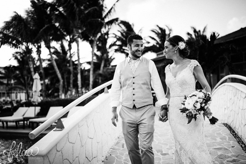 palm trees | images by feliciathephotographer.com | Destination Beach Wedding | Mexico Resort | Photography | Azul Sensatori | portrait | sunset | bridge | holding hands | smiling | true love | black and white | bouquet | 