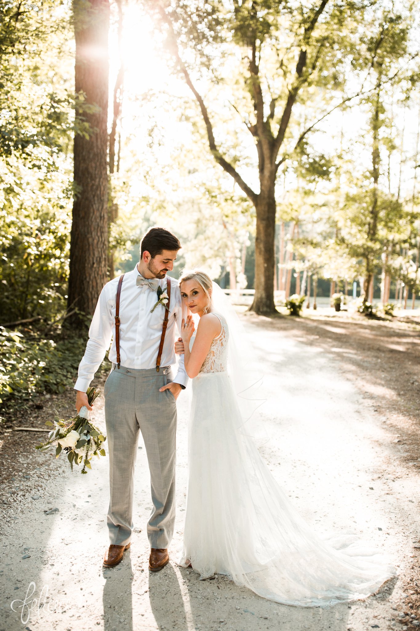 images by feliciathephotographer.com | destination wedding | the makey house | dave gibson coordinator | travel photographer | Savannah, georgia | southern | gravel road | portraits | bride | groom | golden hour | sunset | trees | green | romantic | brown suspenders | lace dress | train | cuddly 