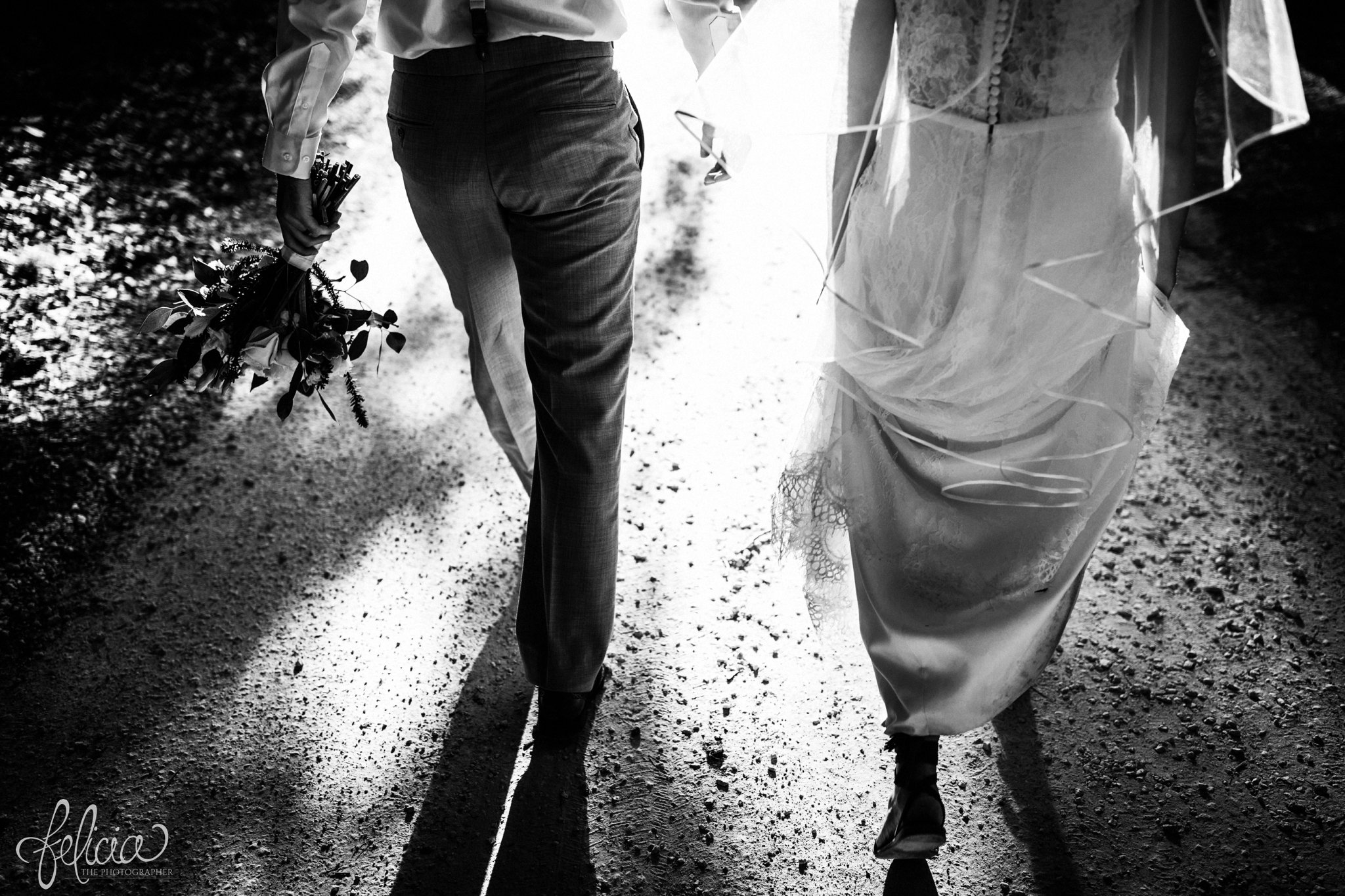 images by feliciathephotographer.com | destination wedding | the makey house | dave gibson coordinator | travel photographer | Savannah, georgia | southern | black and white | portrait | walking | holding hands | gravel road 