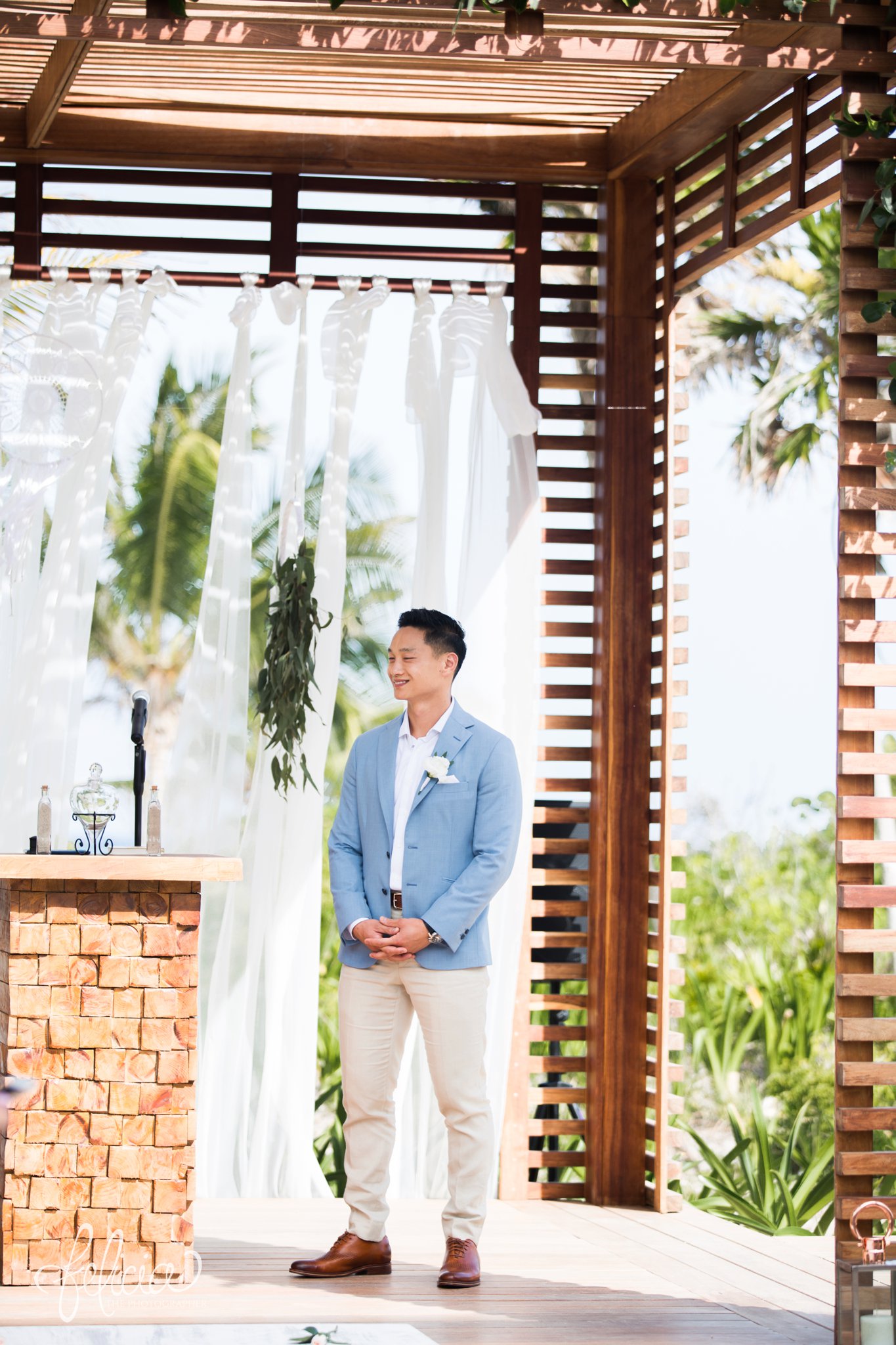 images by feliciathephotographer.com | Destination Beach Wedding | Unicco 20 87 | Photographer | L&S Travel | wood gazebo | ocean view | palm trees | groom | waiting for bride | ceremony | stone altar