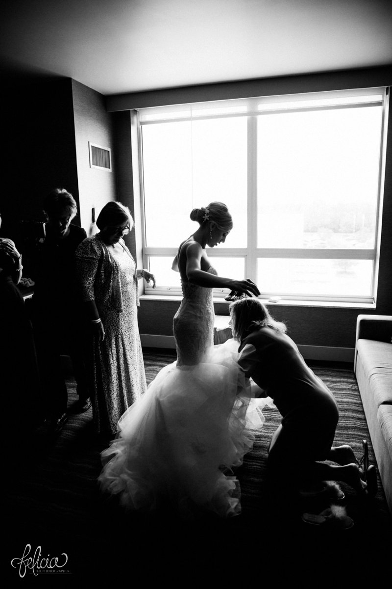 images by feliciathephotographer.com | destination wedding photographer | westin north shore | Chicago botanical gardens | getting ready | putting on the dress | mother of the bride | natural light | contrast | black and white | details | pre-ceremony 
