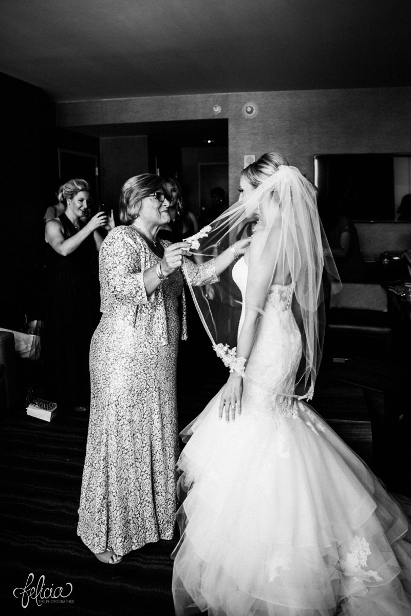 images by feliciathephotographer.com | destination wedding photographer | westin north shore | Chicago botanical gardens | getting ready | putting on the dress | mother of the bride | natural light | contrast | black and white | details | pre-ceremony | veil | sentimental moments | 