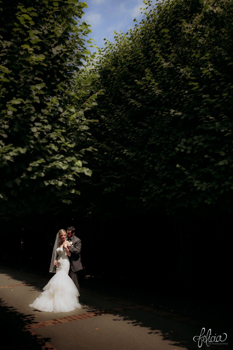 images by feliciathephotographer.com | destination wedding photographer | westin north shore | Chicago botanical gardens | portrait | bride | groom | greenery | trees | contrast | lace tule dress | veil | gray suit | romantic | 