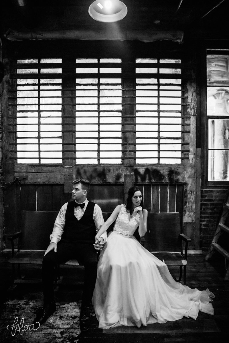 images by feliciathephotographer.com | wedding photographer | kansas city missouri | industrial | romantic | neutral | black and white | portraits | lace two piece dress | holding hands | mia's bridal | warehouse | west bottoms | bow tie 