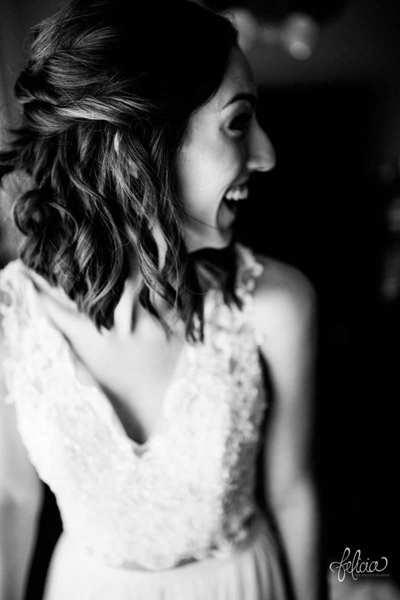 images by feliciathephotographer.com | wedding photographer | kansas city missouri | industrial | romantic | neutral | getting ready | pre-ceremony | black and white | lace dress | curly bob | laughter | joy | 