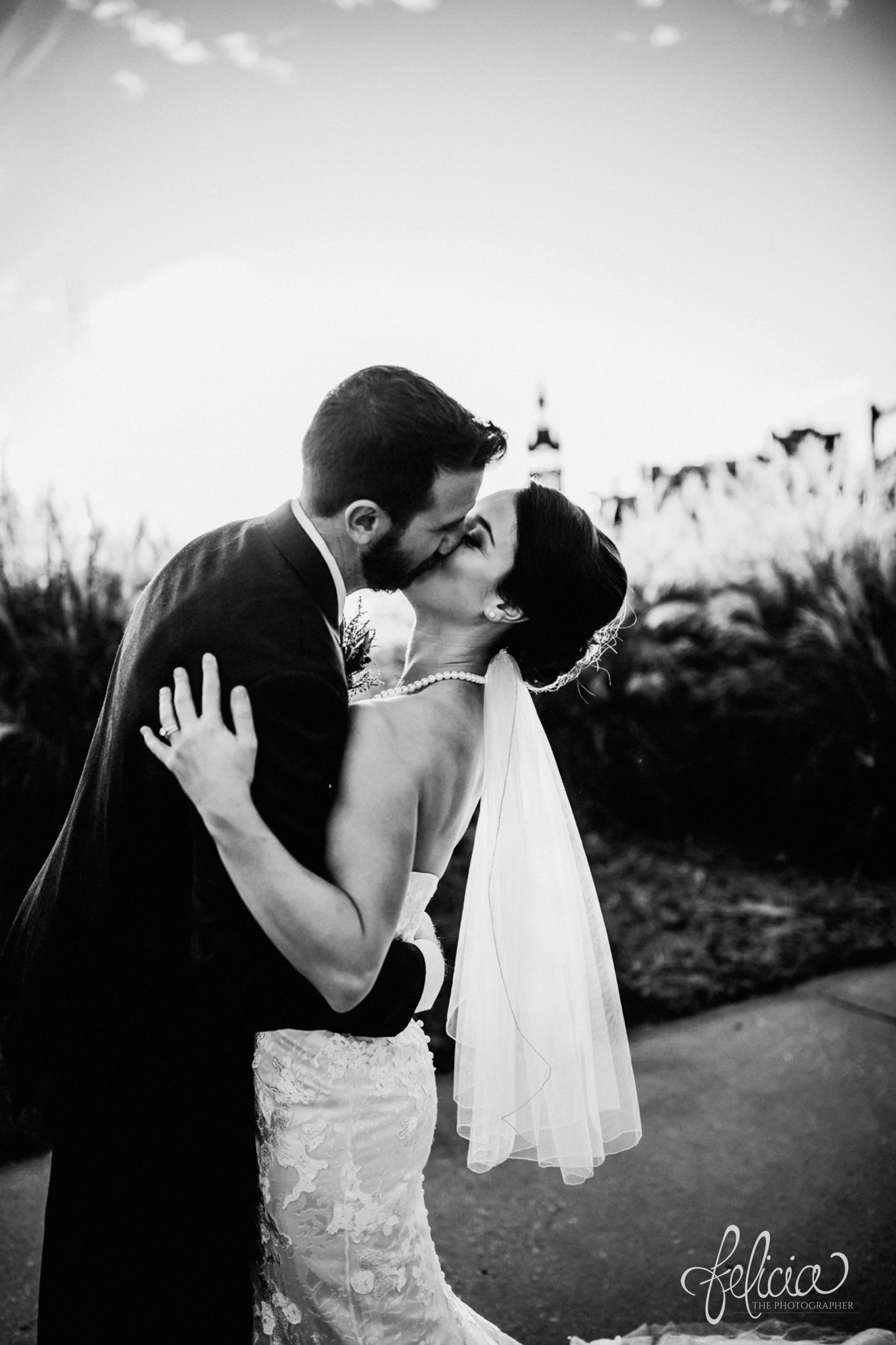 images by feliciathephotographer.com | wedding photographer | kansas city | portrait | bride and groom | pearls | kiss | joy | smokey eye | black and white | 
