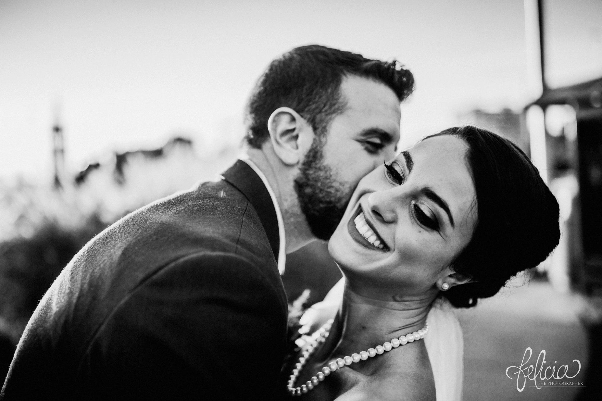 images by feliciathephotographer.com | wedding photographer | kansas city | portrait | bride and groom | pearls | kiss on the cheek | joy | smokey eye | black and white | 