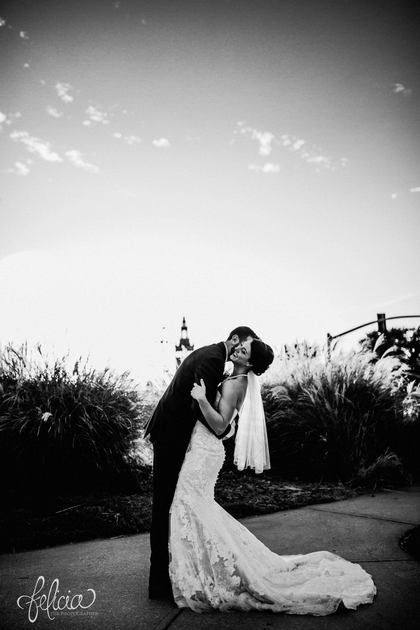 images by feliciathephotographer.com | wedding photographer | kansas city | portrait | black and white | bride and groom | plaza | emily hart | lace floral dress | short veil | wheat | 