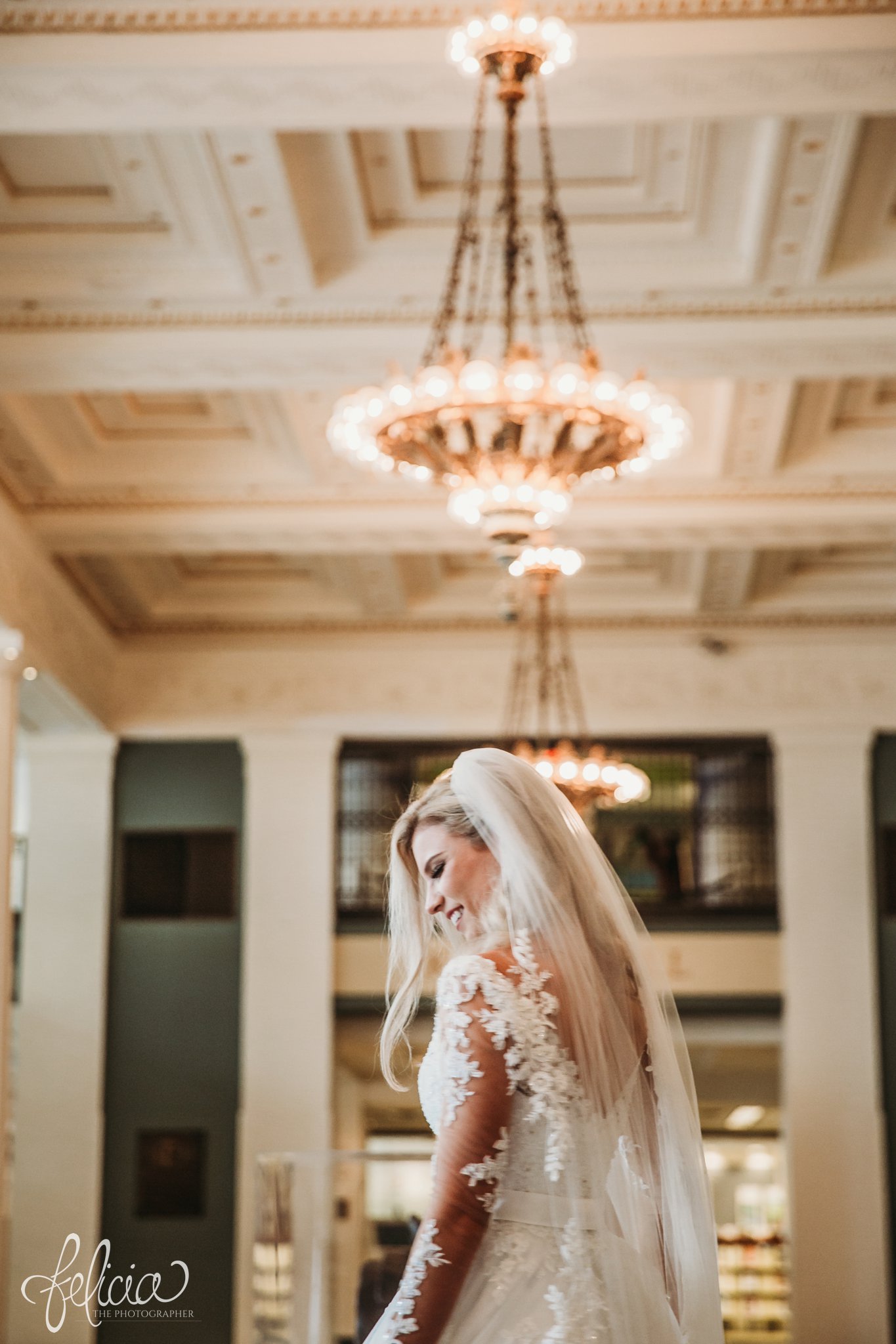 images by feliciathephotographer.com | wedding photographer | kansas city | redemptorist | classic | whimsical | romantic | chandelier | bride | lace dress | portrait | belle vogue | joy | veil | long sleeve |