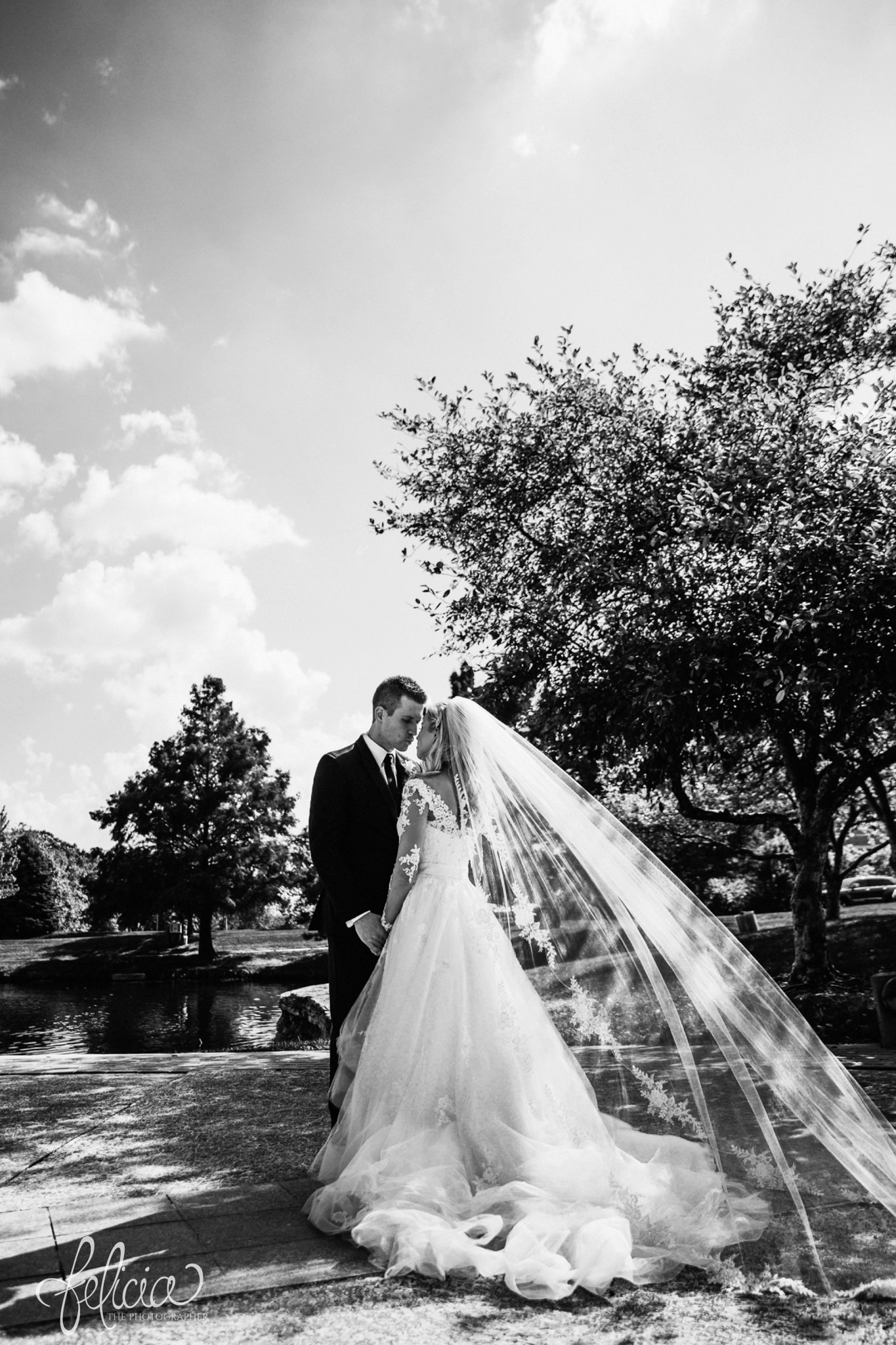 images by feliciathephotographer.com | wedding photographer | kansas city | redemptorist | classic | portrait | whimsical | romantic | flowing veil | lace long sleeve dress | bride and groom | trees | black and white | 