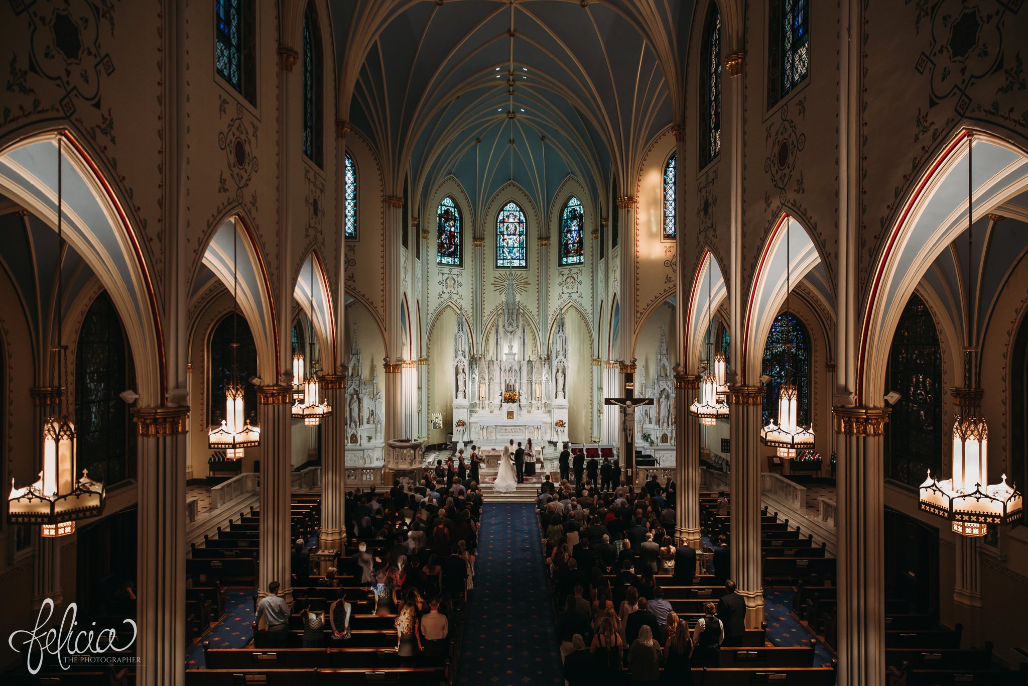 images by feliciathephotographer.com | wedding photographer | kansas city | redemptorist | classic | catholic | our lady of perpetual help | church | ceremony | bride and groom | praying | romantic lighting |