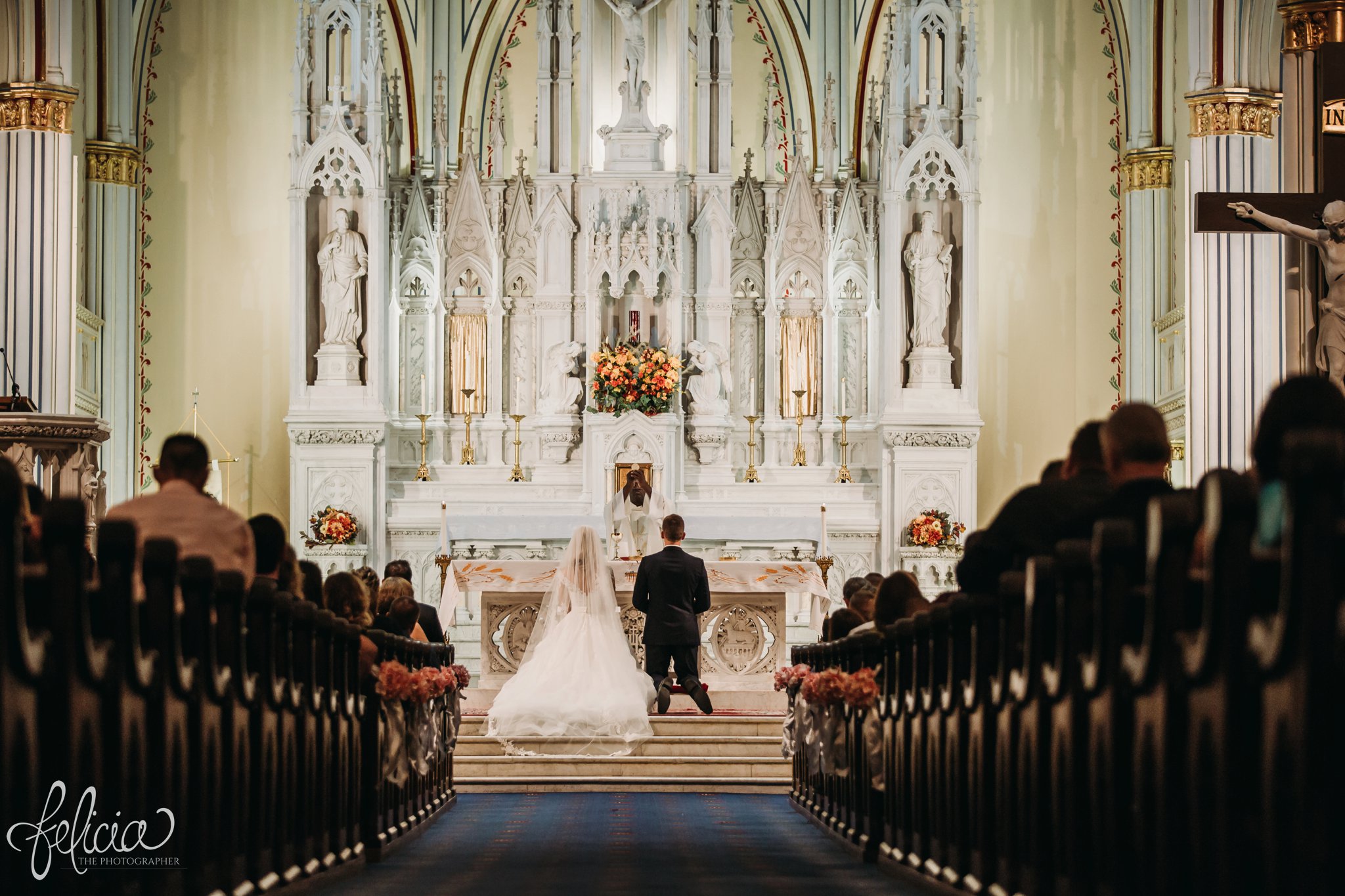 images by feliciathephotographer.com | wedding photographer | kansas city | redemptorist | classic | catholic | bride and groom | kneeling prayer | our lady of perpetual help | symmetrical | pews | true love | romantic | 