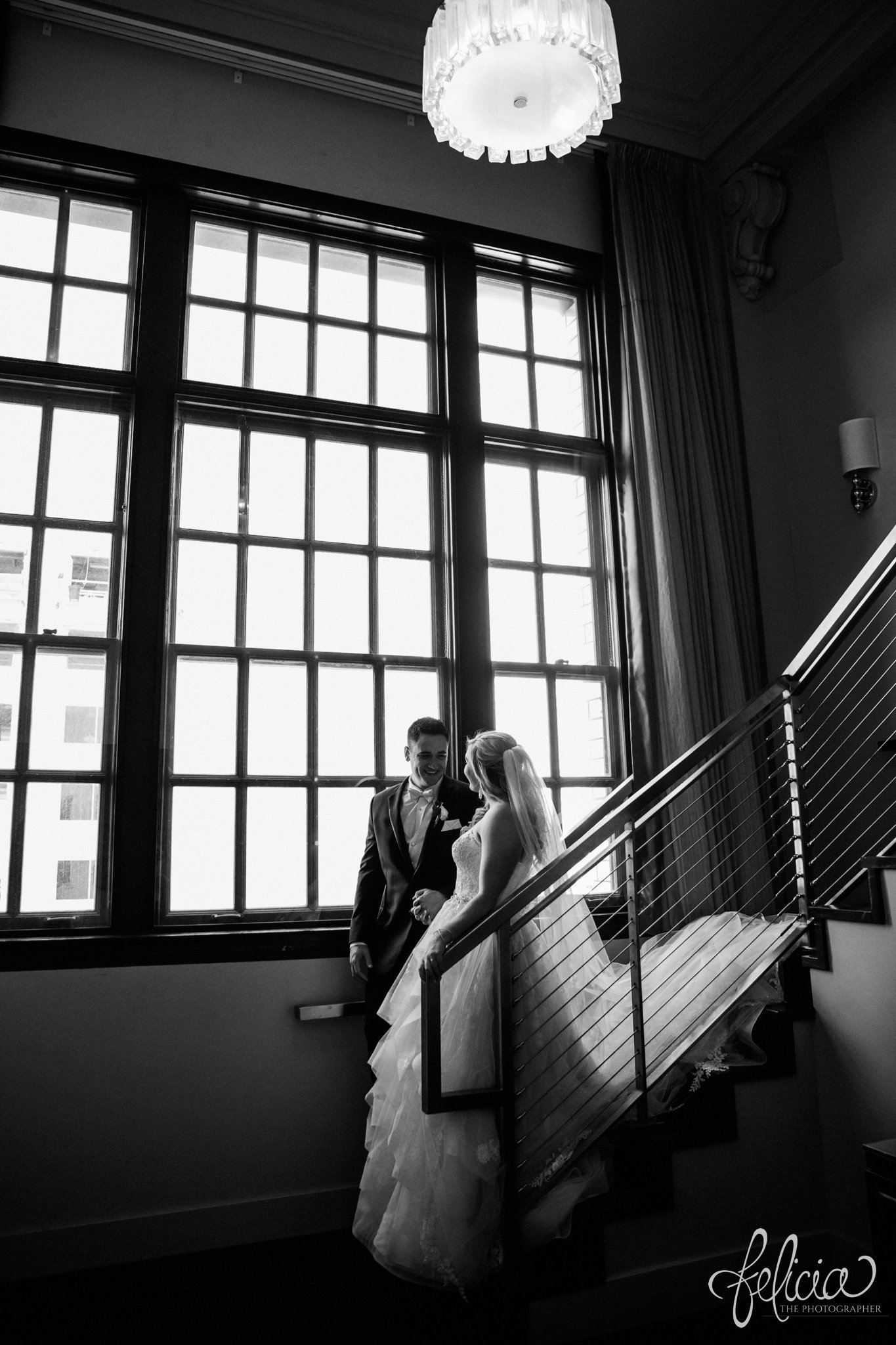 images by feliciathephotographer.com | wedding photographer | downtown kansas city | first look | hotel ambassador | natural lighting | romantic | belle vogue | mens warehouse | glamorous | intimate | black and white | 
