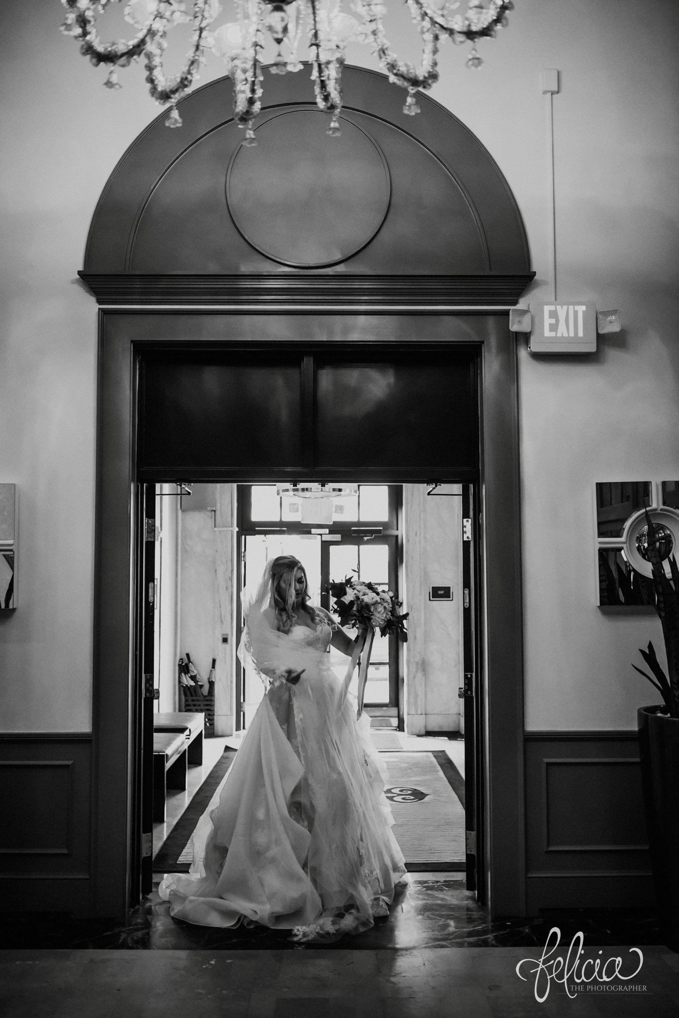 images by feliciathephotographer.com | wedding photographer | downtown kansas city | black and white | bridal portrait | chandelier | full skirt | lace dress | wild hill flowers | belle vogue | 
