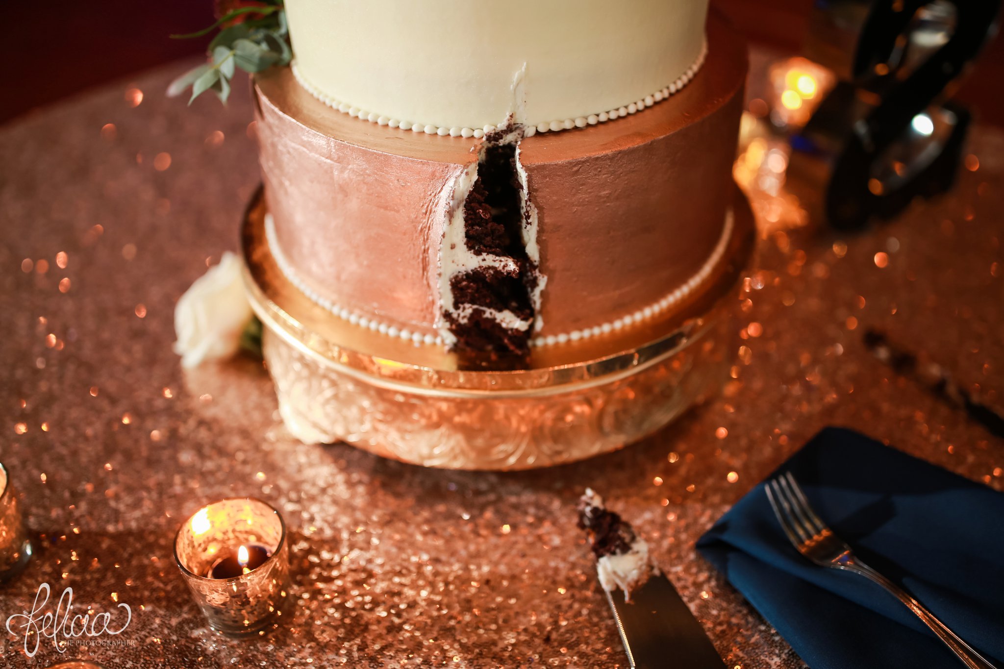 images by feliciathephotographer.com | wedding photographer | downtown kansas city | candle | cutting the cake | details | reception | rose gold | sequins | mclain's bakery | navy | 