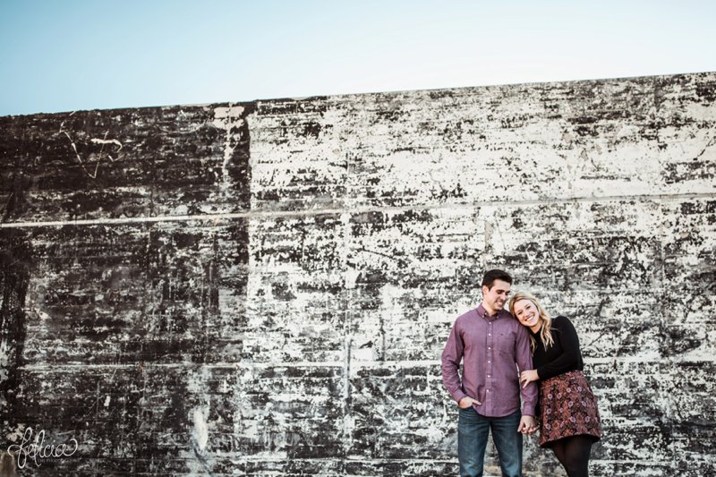 images by feliciathephotographer.com | engagement photographer | kansas city | boho | chill | edgy | esession wardrobe inspo | what to wear | purple | burgundy | natural | romantic | laughter | industrial wall | holding hands |