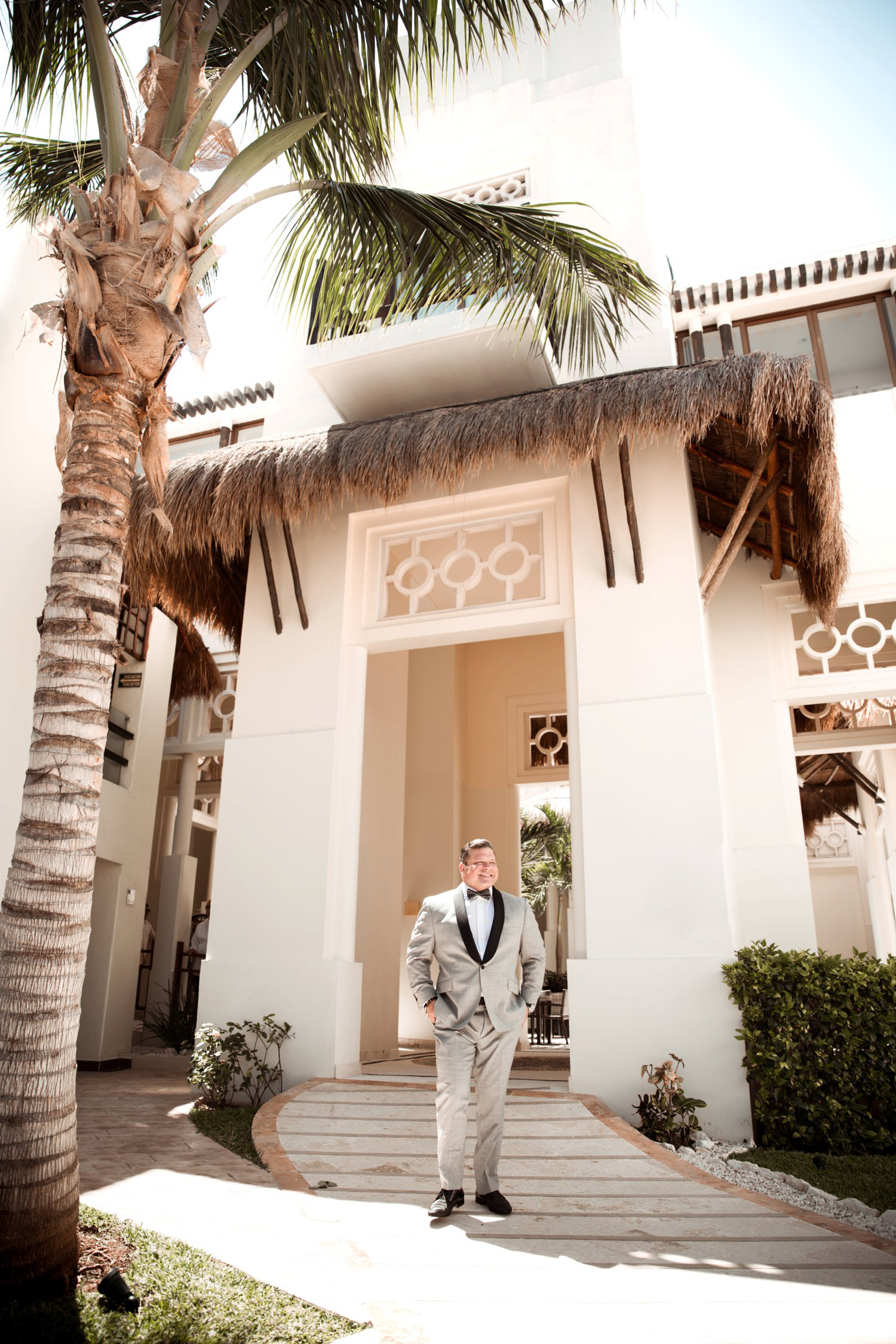  images by feliciathephotographer.com | destination wedding photographer | mexico | tropical | fiji | venue | azul beach resort | riviera maya | getting ready | details | groom | palm trees | pre-ceremony | grey suit | black tie attire | 