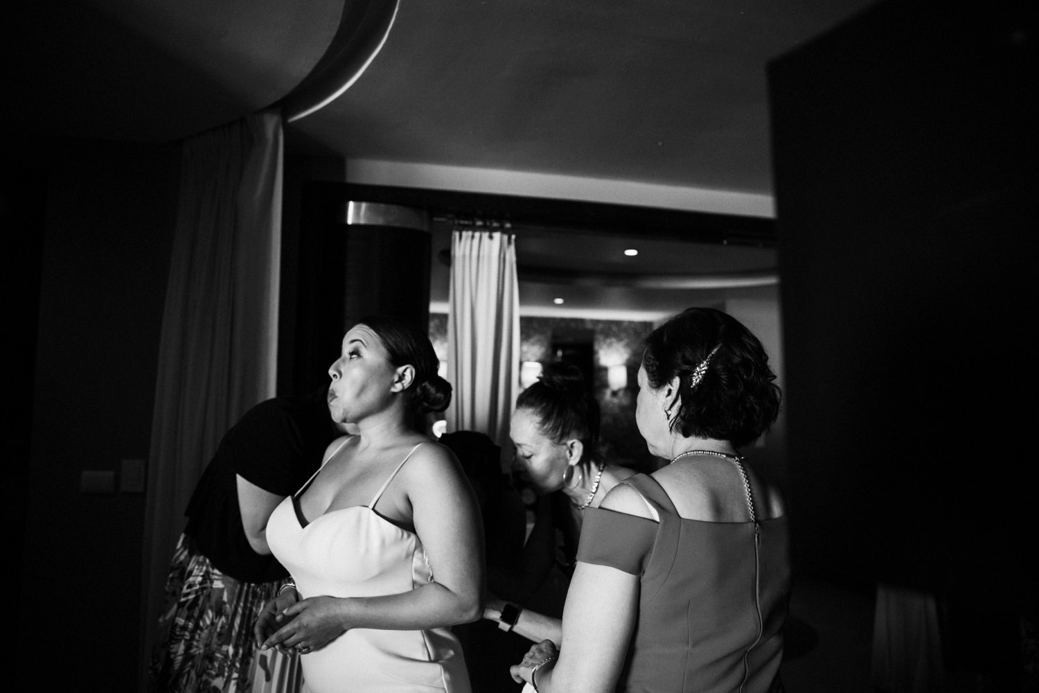  images by feliciathephotographer.com | destination wedding photographer | mexico | tropical | fiji | venue | azul beach resort | riviera maya | getting ready | details | black and white | putting on the dress | mother of the bride | jaehee atelier | pre-ceremony | 
