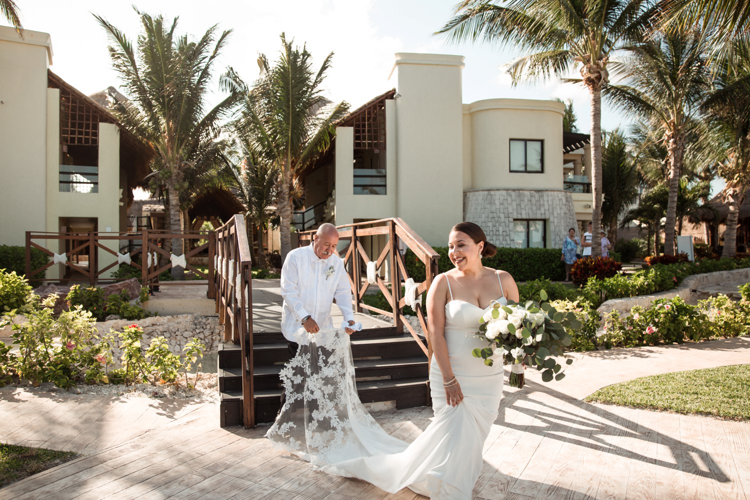  images by feliciathephotographer.com | destination wedding photographer | mexico | tropical | fiji | venue | azul beach resort | riviera maya | ceremony | palm trees | walking down the aisle | long lace train | father of the bride |