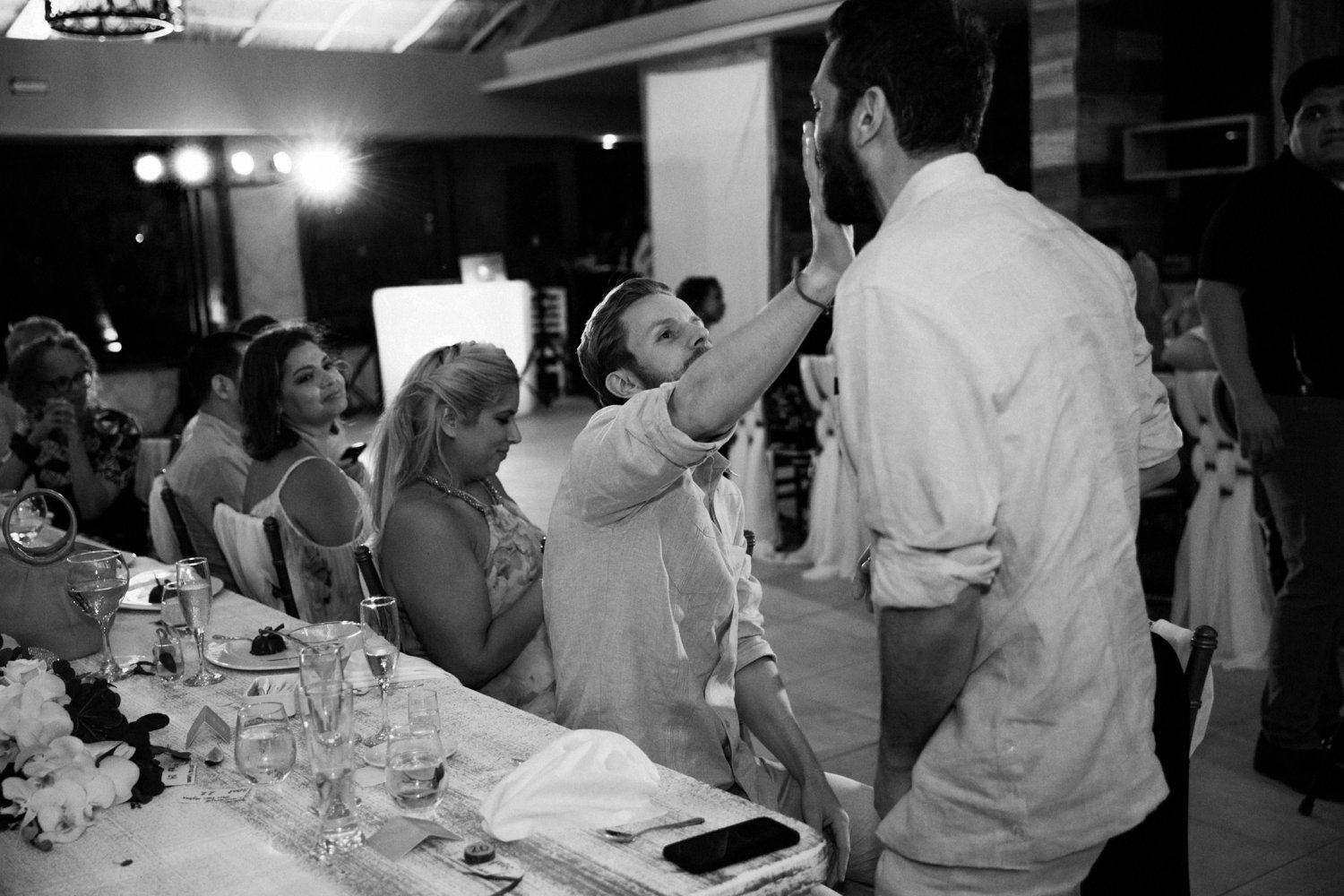  images by feliciathephotographer.com | destination wedding photographer | mexico | tropical | fiji | venue | azul beach resort | riviera maya | reception | guests | best man | tearing up | black and white | toasts | 