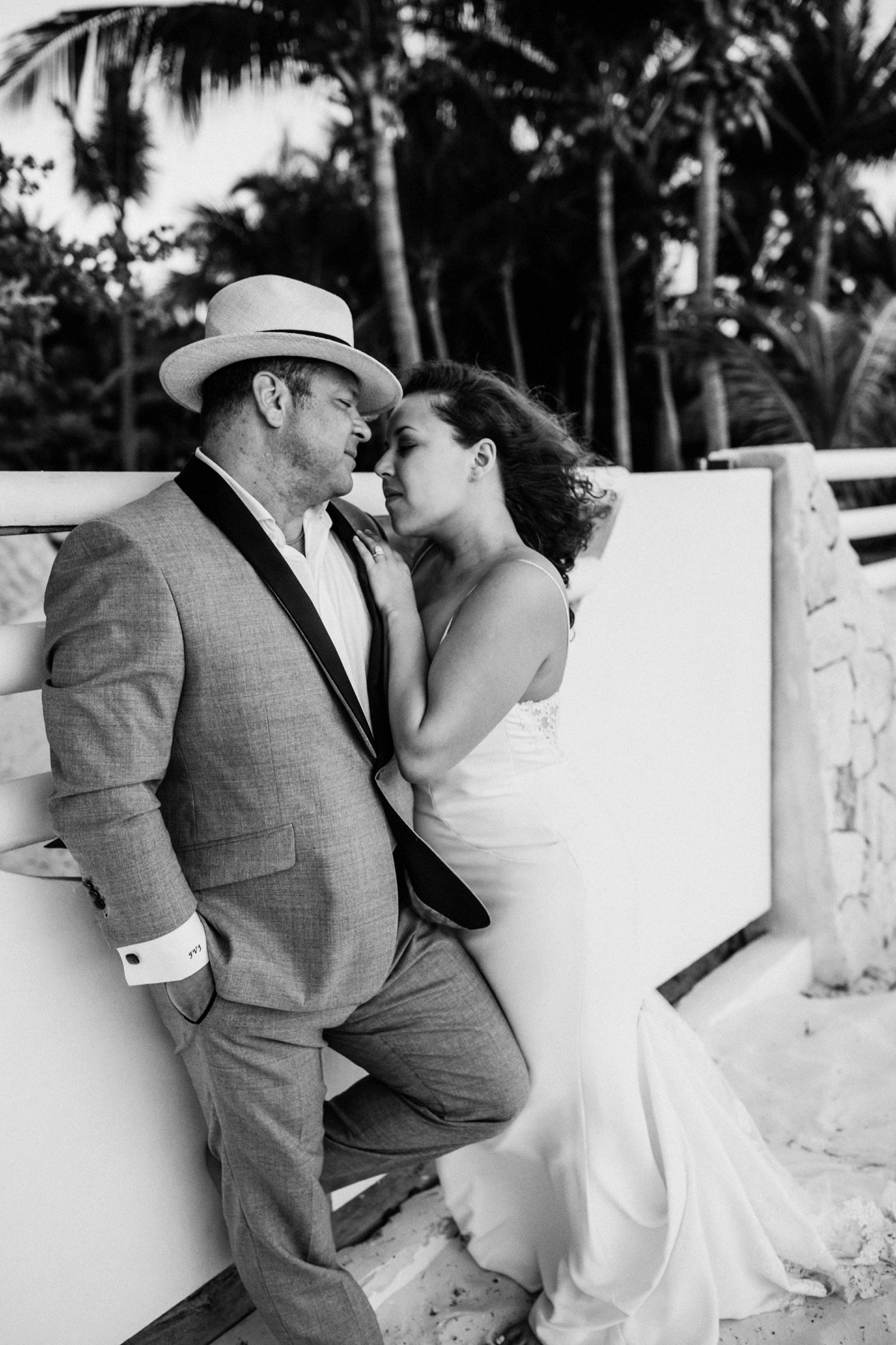  images by feliciathephotographer.com | destination wedding photographer | mexico | tropical | fiji | venue | azul beach resort | riviera maya | sunrise portraits | walking by the ocean | black and white | bride and groom | romantic | whimsical | long gown | grey suit | 