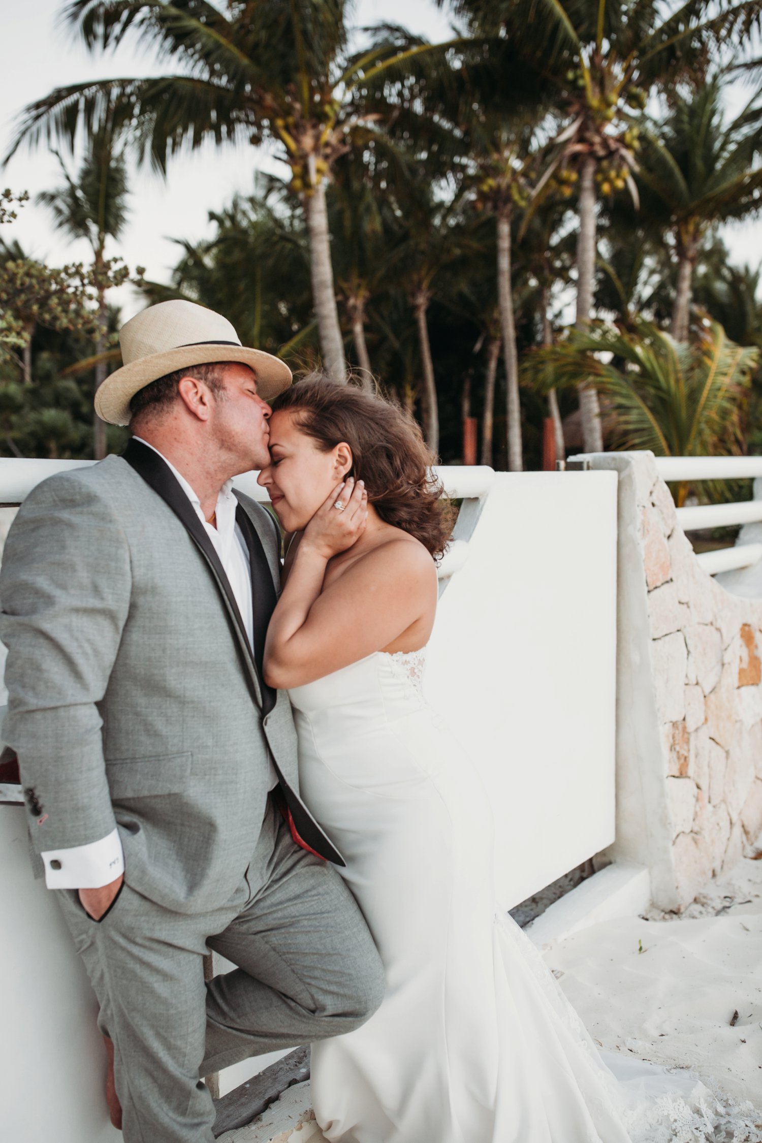  images by feliciathephotographer.com | destination wedding photographer | mexico | tropical | fiji | venue | azul beach resort | riviera maya | sunrise picture | bridal portraits | palm trees | romantic | forehead kiss | 