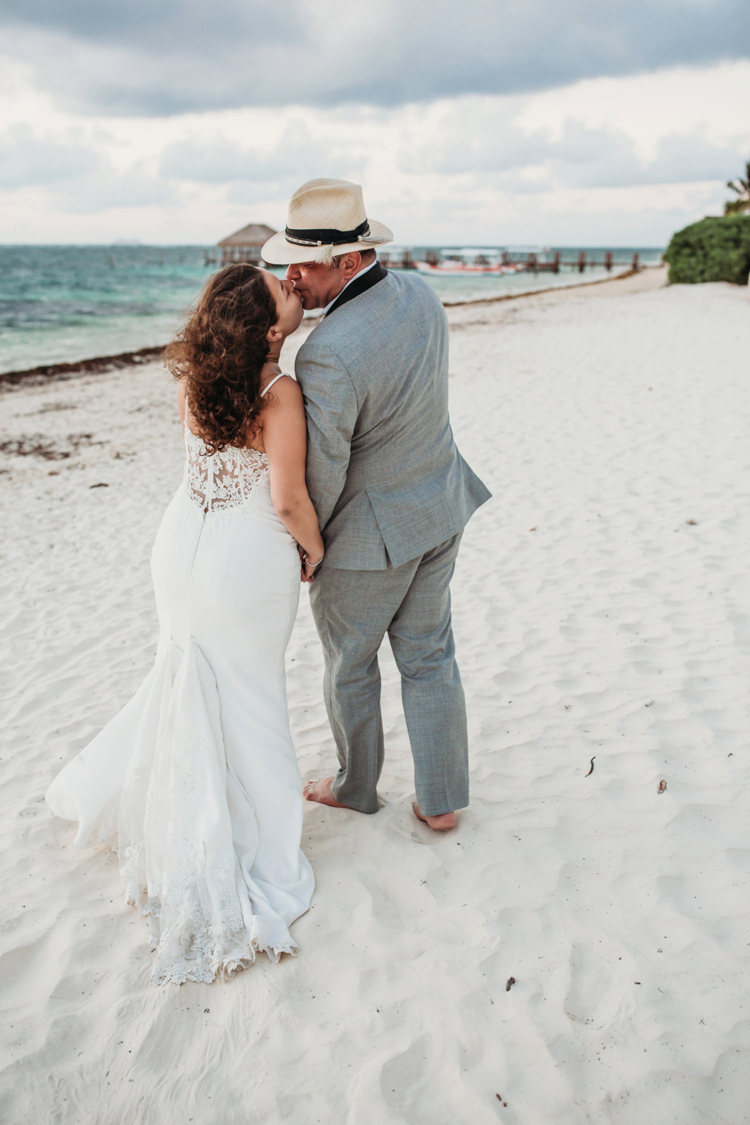  images by feliciathephotographer.com | destination wedding photographer | mexico | tropical | fiji | venue | azul beach resort | riviera maya | sunrise picture | bridal portraits | palm trees | romantic | kiss | walking by the ocean | 