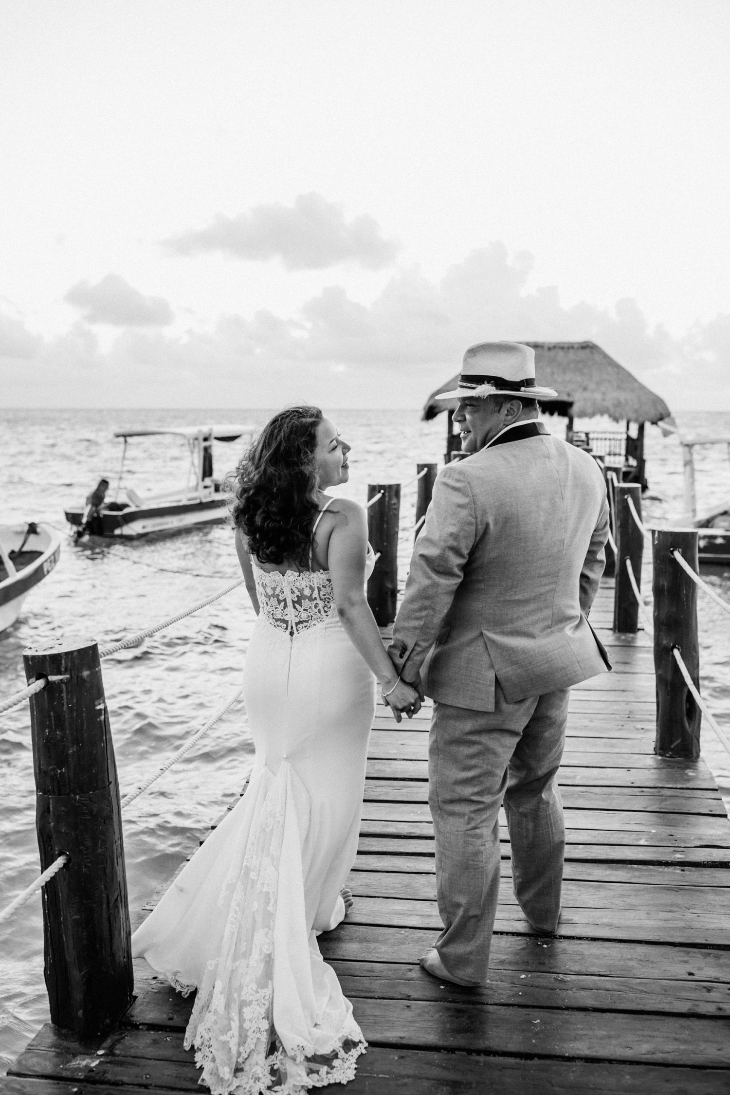  images by feliciathephotographer.com | destination wedding photographer | mexico | tropical | fiji | venue | azul beach resort | riviera maya | black and white | sunrise | bridal portraits | lace dress | grey suit | marina | oceanside | barefoot | 