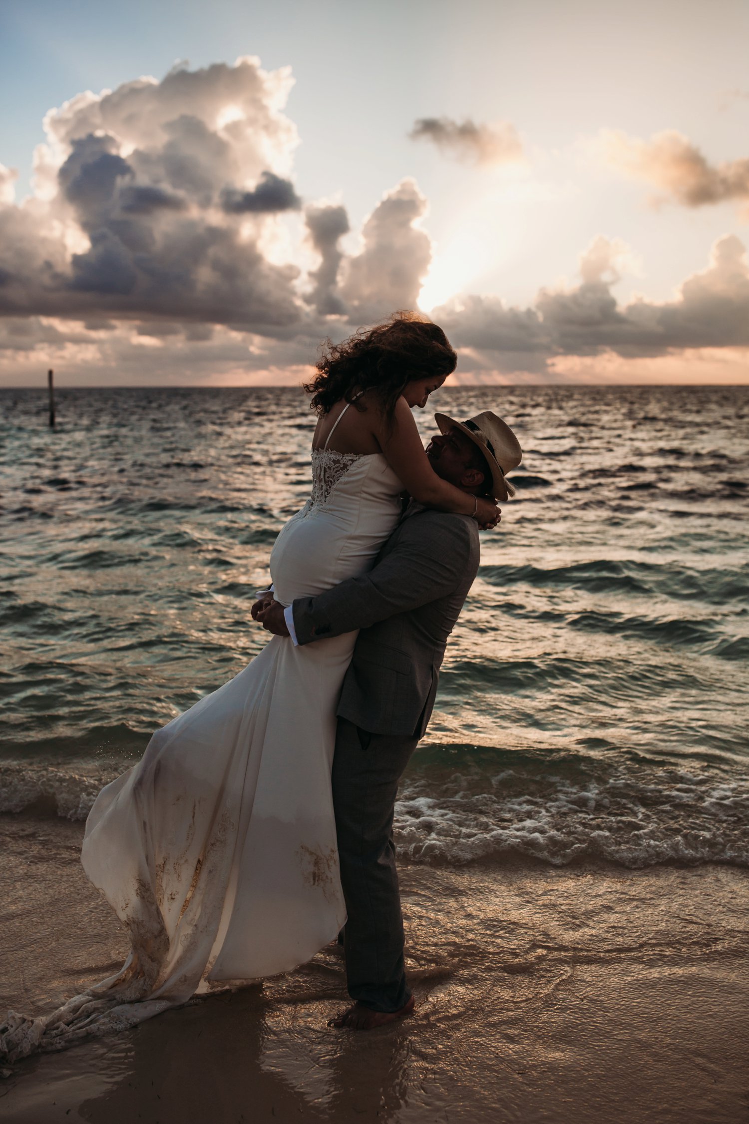  images by feliciathephotographer.com | destination wedding photographer | mexico | tropical | fiji | venue | azul beach resort | riviera maya | bridal sunrise portraits | cotton candy skies | ocean | romantic | whimsical | long lace train | dancing in the water | 