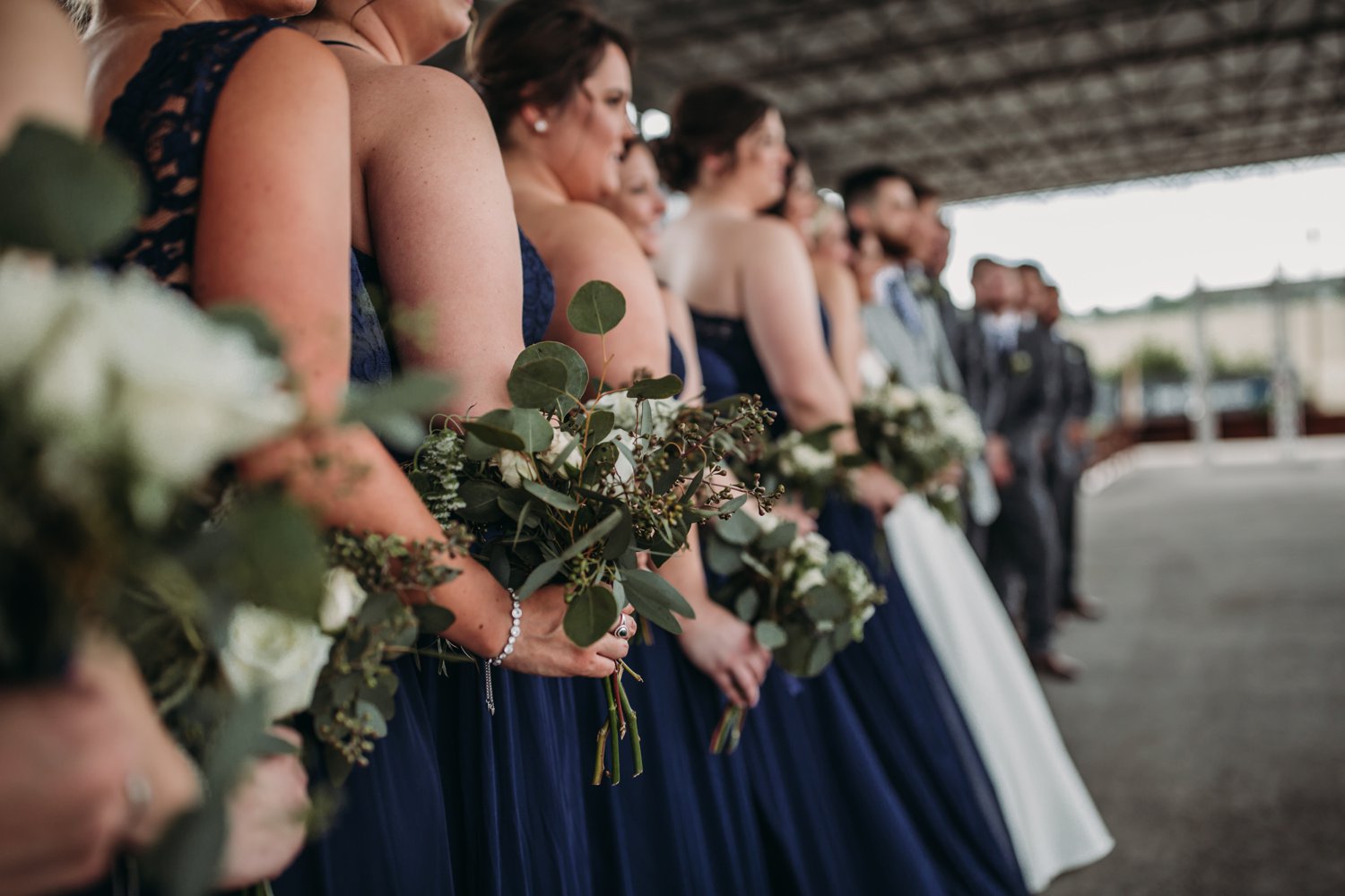  images by feliciathephotographer.com | destination wedding photographer | kansas city | spring time | second shooter | adorned floral design | eucalyptus | navy dresses | david's bridal | 